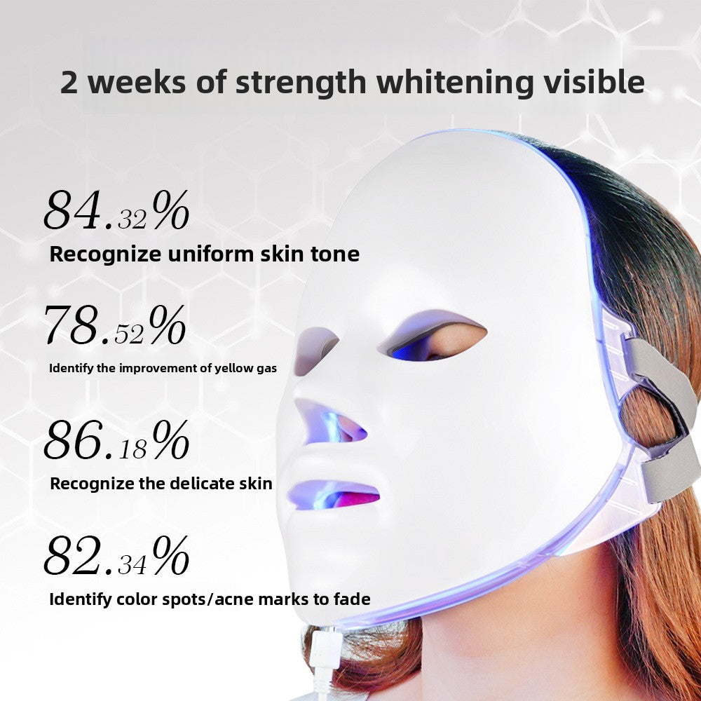 Person wearing a LED face mask with text on strength whitening and skin improvement.