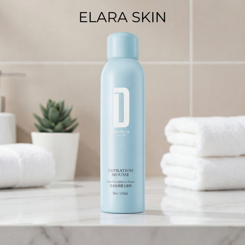 Blue bottle of ELARA SKIN Depilation Mousse on a bathroom counter with towels and a plant in the background.